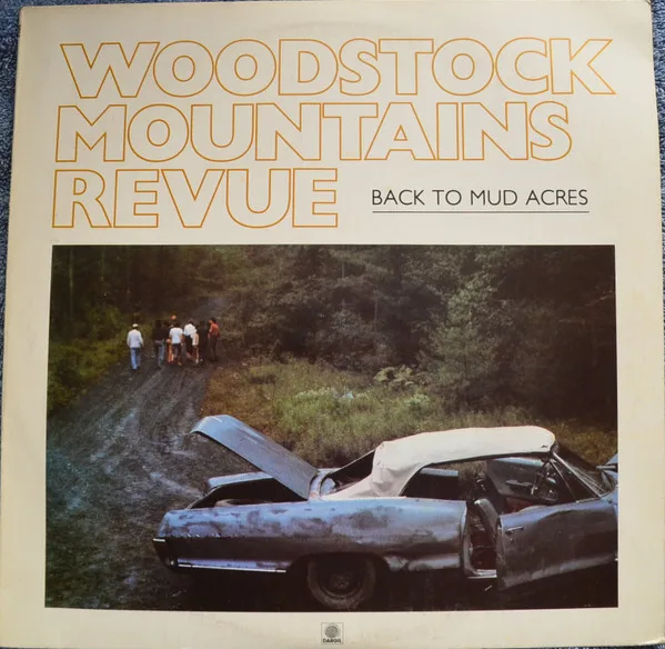 Capa de Woodstock Mountains Revue — Back To Mud Acres